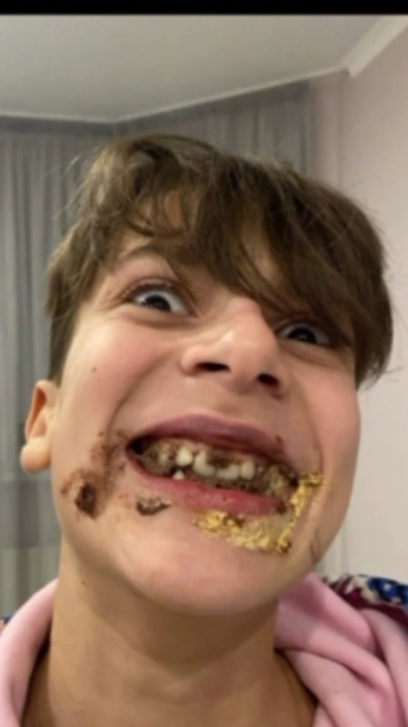 Create meme: boy , people , the boy eats chocolate