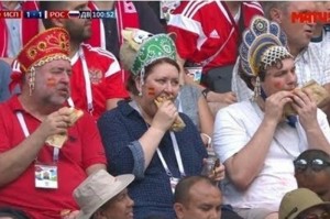 Create meme: football trio in the headdress, photo fans in the headdress of the match Russia Spain 2018, fans in headdresses Russia Spain