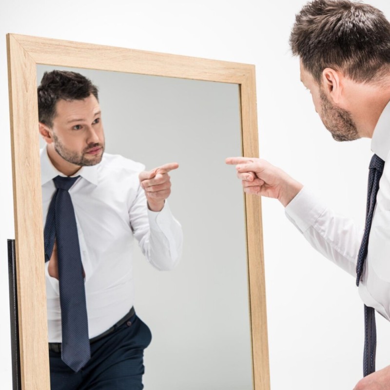 Create meme: a man is arguing with a mirror, male reflection in the mirror, a man looks in the mirror