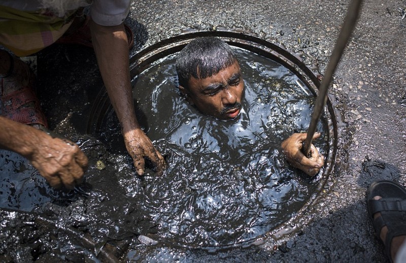 Create meme: the sewer cleaner in Bangladesh, sewer diver bangladesh, cleaner sewer