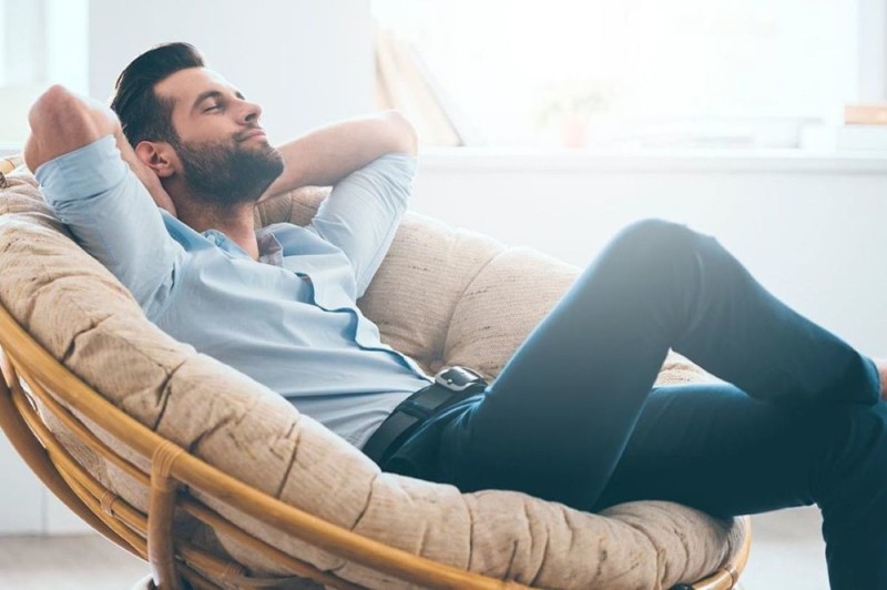 Create meme: the man on the couch, male , A businessman is relaxing on the couch