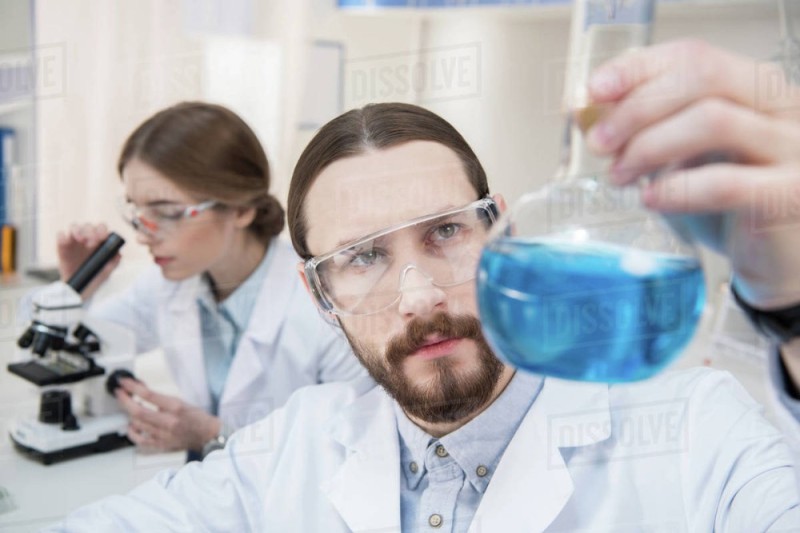 Create meme: scientist with a flask, scientist , scientists in the laboratory