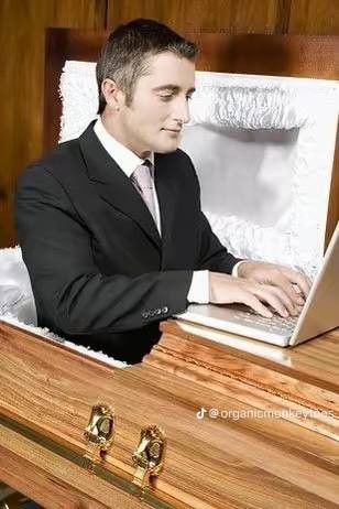 Create meme: early in the morning, a man in a coffin with a laptop, the man in the coffin