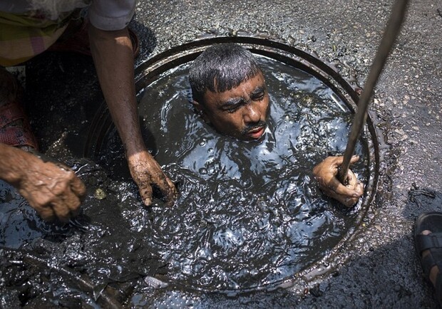 Create meme: the sewer cleaner in Bangladesh, sewer cleaning, sewer diver bangladesh