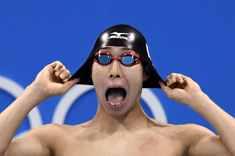 Create meme: Michael Phelps Rio 2016, funny faces of athletes , famous swimmers