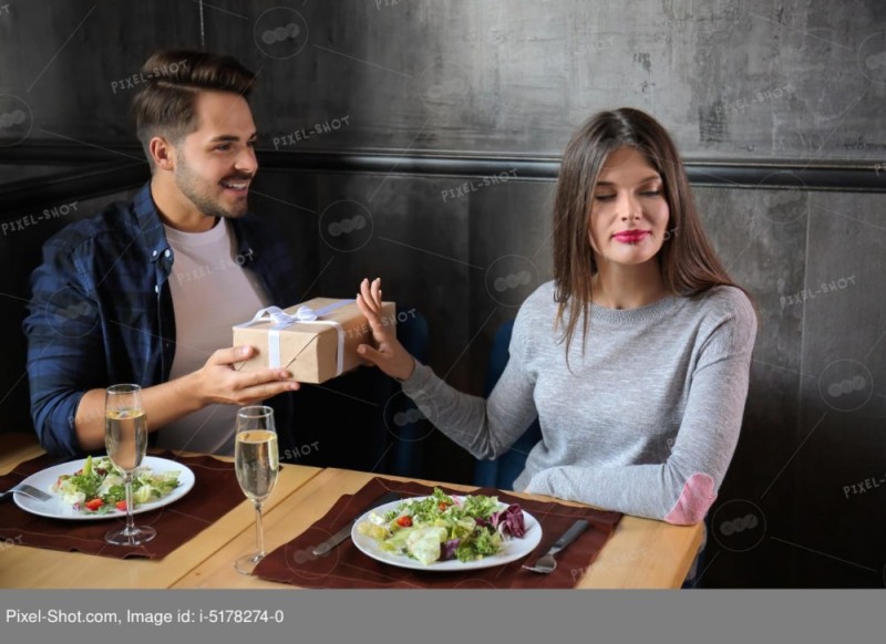 Create meme: date in a restaurant, a man gives gifts, women are fighting in a restaurant