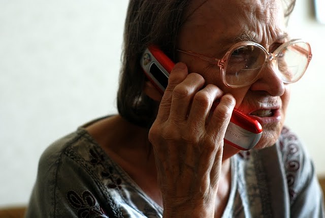 Create meme: grandma's phone number, phone Scam , An old lady with a phone