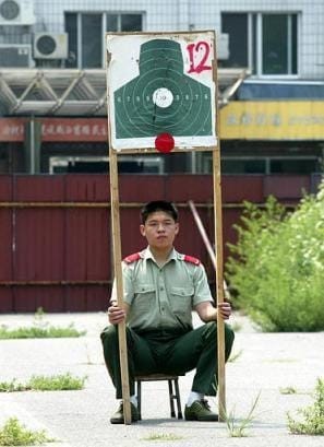 Create meme: A Chinese man holds a target, professions with humor, funny photo