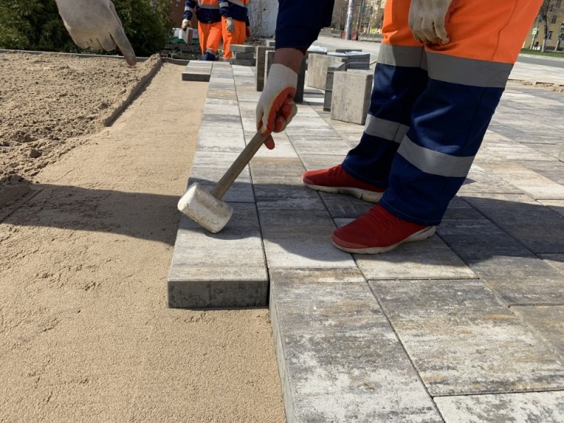 Create meme: paving slabs laying, laying tiles on the street, paving stones