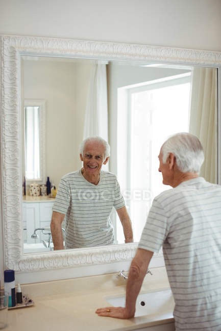 Create meme: a person looks in the mirror, I look in the mirror, a man looks in the mirror