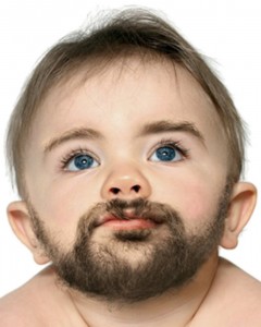 Create meme: cute boy with a beard, a baby with a mustache joke, how old the boy is growing a beard