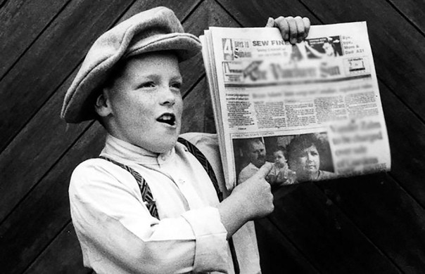 Create meme: a boy with a newspaper, newspaper delivery boy, a boy holds a newspaper