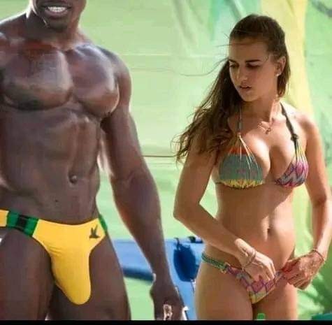 Create meme: girl , Russian in a swimsuit with a black man, beautiful inflated Negros