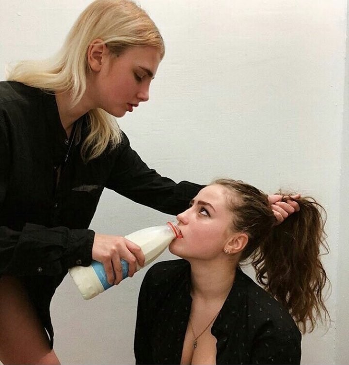 Create meme: drinking milk, forcing to drink milk, a girl gives milk to another