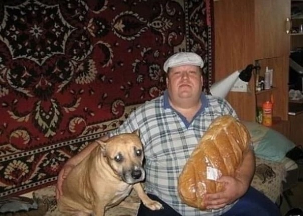 Create meme: a man with a dog and a loaf, a man with a loaf and a dog meme, a man is sitting with a loaf and a dog