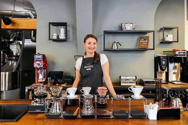 Create meme: barista in a coffee shop, Barista, A man with coffee in a coffee shop