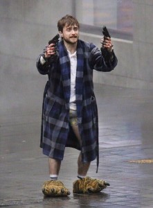 Create meme: guns akimbo, Daniel Radcliffe with guns in a Bathrobe, Daniel Radcliffe guns akimbo