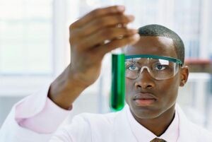 Create meme: the negro scientist, a negro with a test tube, chalk Board