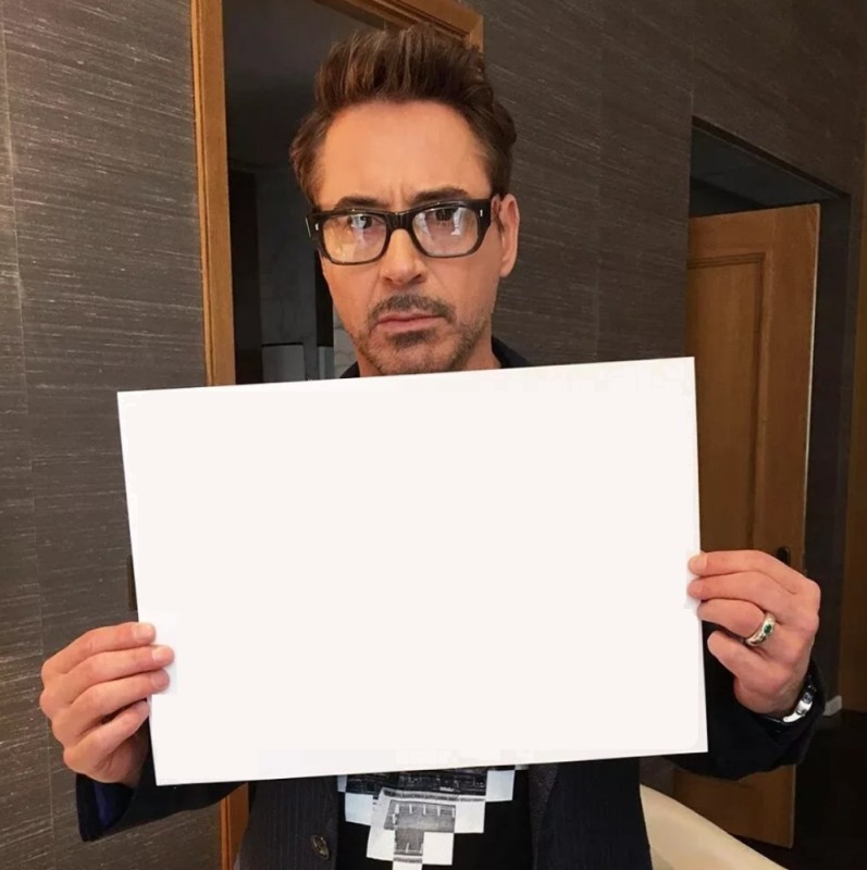 Create meme: Robert Downey , Robert Downey holds, nerd 