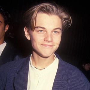 Create meme: hollywood, Leonardo DiCaprio young in a suit, Leonardo DiCaprio young boy a pink sweater