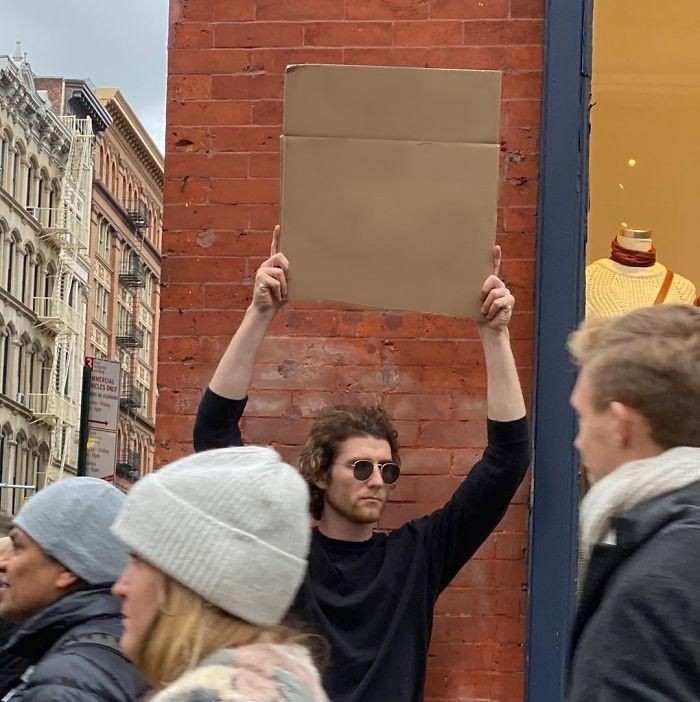 Create meme: picket , people, a man with a poster on the street