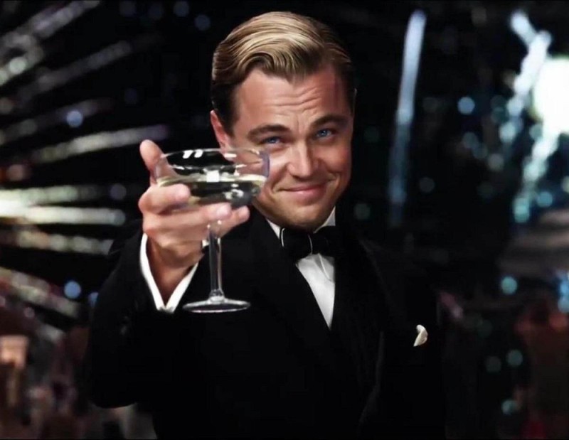 Create meme: DiCaprio with a glass of, Leonardo DiCaprio Gatsby, Leonardo DiCaprio raises a glass