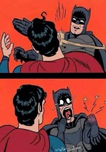 Создать мем: Superman beats Batman