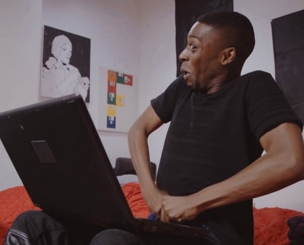 Create meme: a black man with a laptop, A black man puts his hand in his pants meme, meme the Negro with a laptop