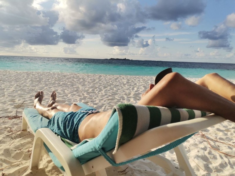 Create meme: sun loungers on the beach, The girl is lying on a chaise longue, girl on the beach