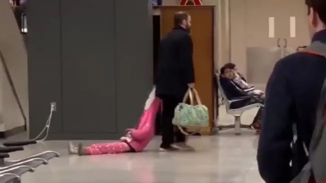 Create meme: drags the child by the hood, at the airport, people