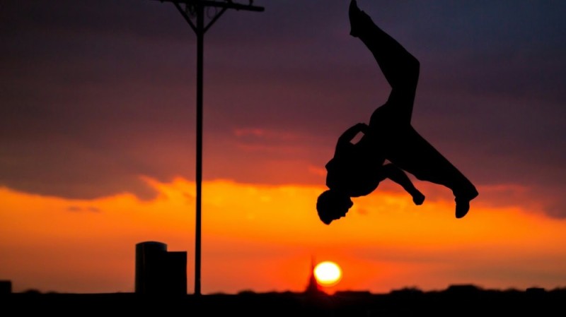 Create meme: parkourist, parkour at sunset, back flip