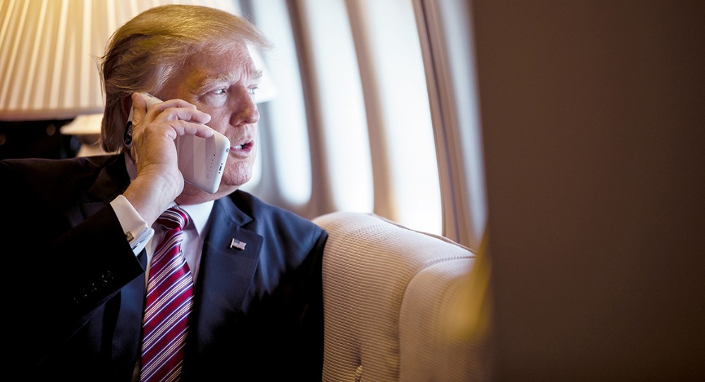 Create meme: Donald Trump's smartphone, trump with the phone, Trump is on the phone