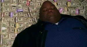 Create meme: a Negro on a pile of money, the Negro is on the money in all serious, fat black on the money
