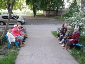 Create meme: grandmother on a bench at the entrance, grandmothers on the bench, woman