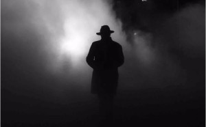 Create meme: pictures of mysterious people, a mysterious man in a cloak, a dark silhouette of a man in the hat