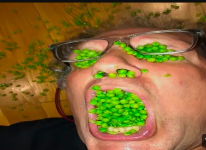 Create meme: A man with peas in his mouth, a man with peas in his mouth, the man in the peas