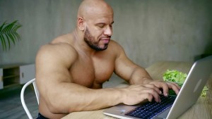 Create meme: bodybuilder, muscle man with computer, men
