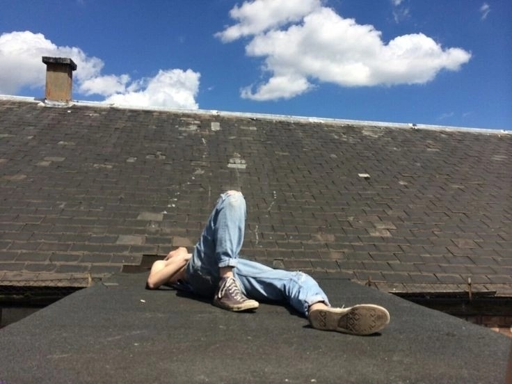 Create meme: A man is sitting on the roof, Sitting on the roof, Lying on the roof