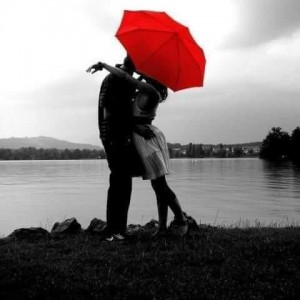Create meme: romantic pictures, Two under one umbrella, couple with red umbrella
