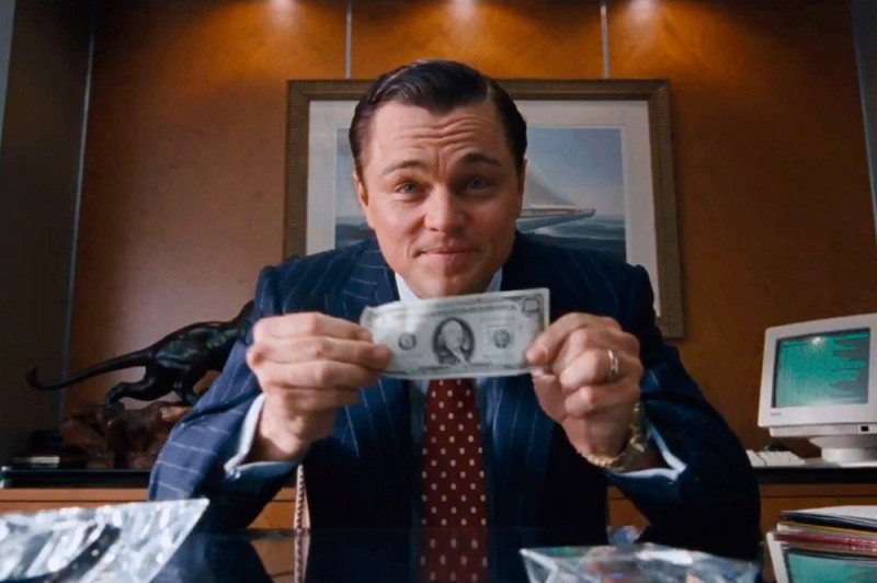 Create meme: Leonardo DiCaprio the wolf of wall, The wolf of Wall Street with a dollar, the wolf of wall street the money