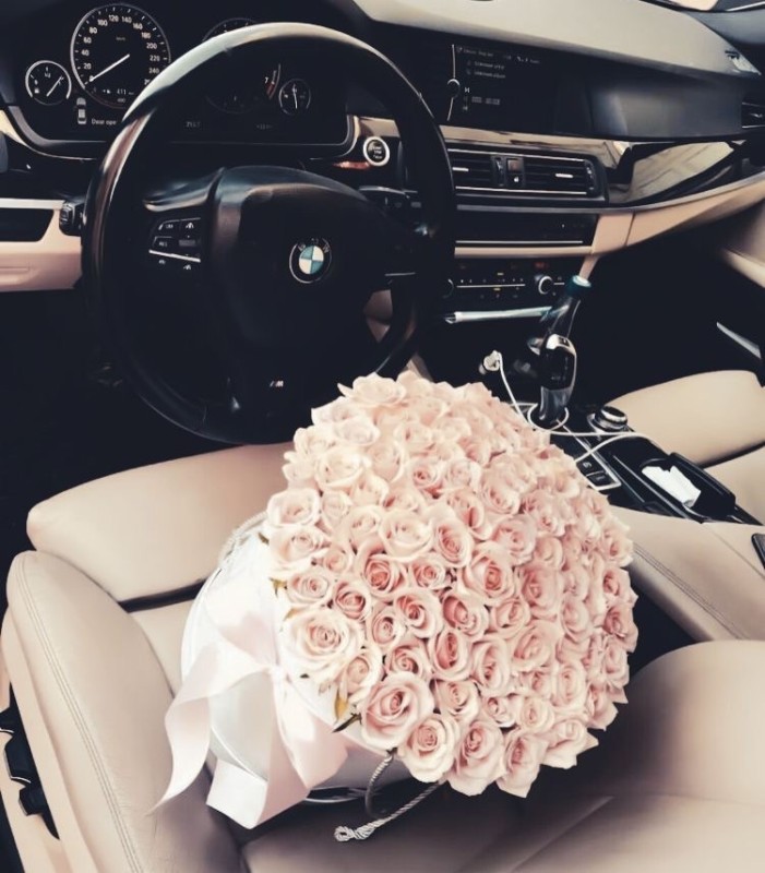 Create meme: BMW x6 with flowers, flowers in bmw, a bouquet in a BMW car