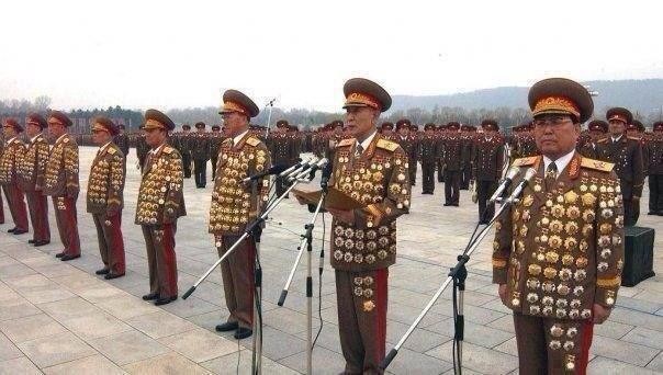 Создать мем: северокорейские генералы в орденах, корейские генералы в орденах, генералы северной кореи в орденах