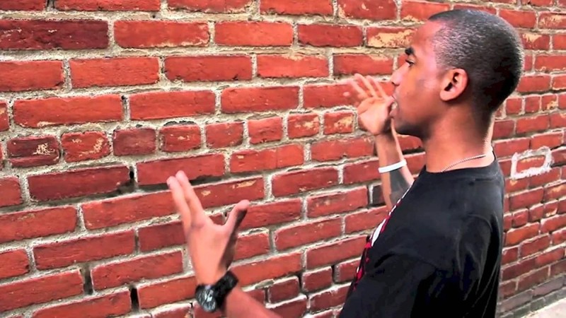 Create meme: a man talks to a wall, a man is talking to a wall, the black speaks with the wall