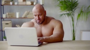 Create meme: meme Jock, Jock at the computer, a wrestler with a laptop