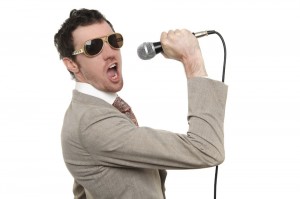 Create meme: man singing into microphone 4 pics 1 word, singing, singing