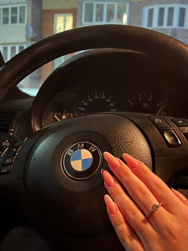 Create meme: bmw steering wheels, bmw m steering wheel, the girl driving the BMW