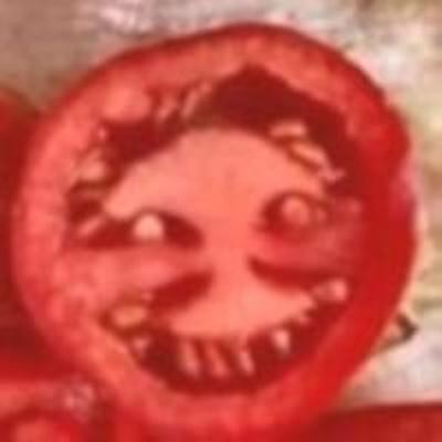 Create meme: tomato , scary tomato, sliced tomato