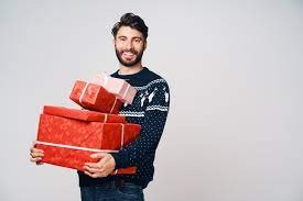 Create meme: man gift, a man holds a gift, A gift for men on New Year's Eve