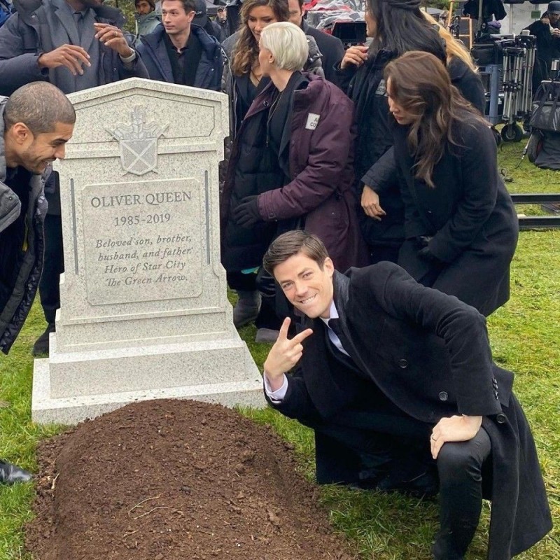 Create meme: the grave of a man, grave , Grant Gustin at Oliver Queen's grave