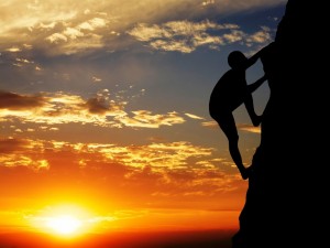 Create meme: mountain climber at sunset, purposeful woman rock climber at sunset, rock climber on sunset background